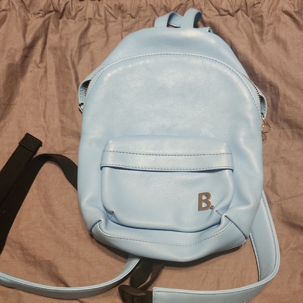 Light Blue Balenciaga Authenic mini backpack with B Logo.